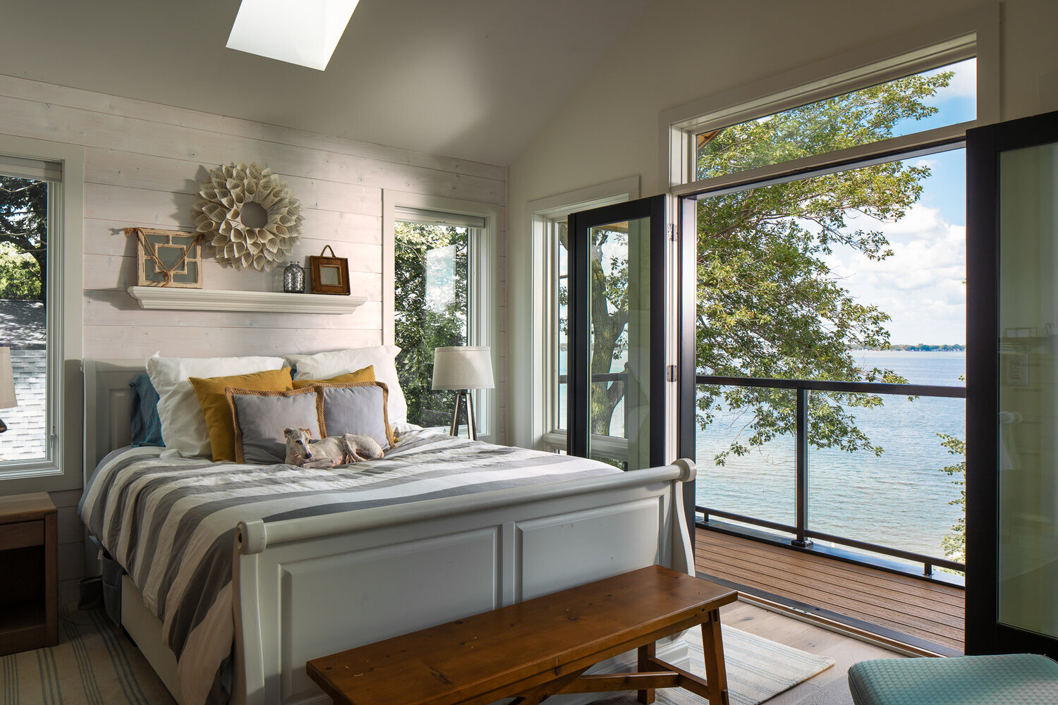 Master bedroom with dog overlooking clear lake Iowa