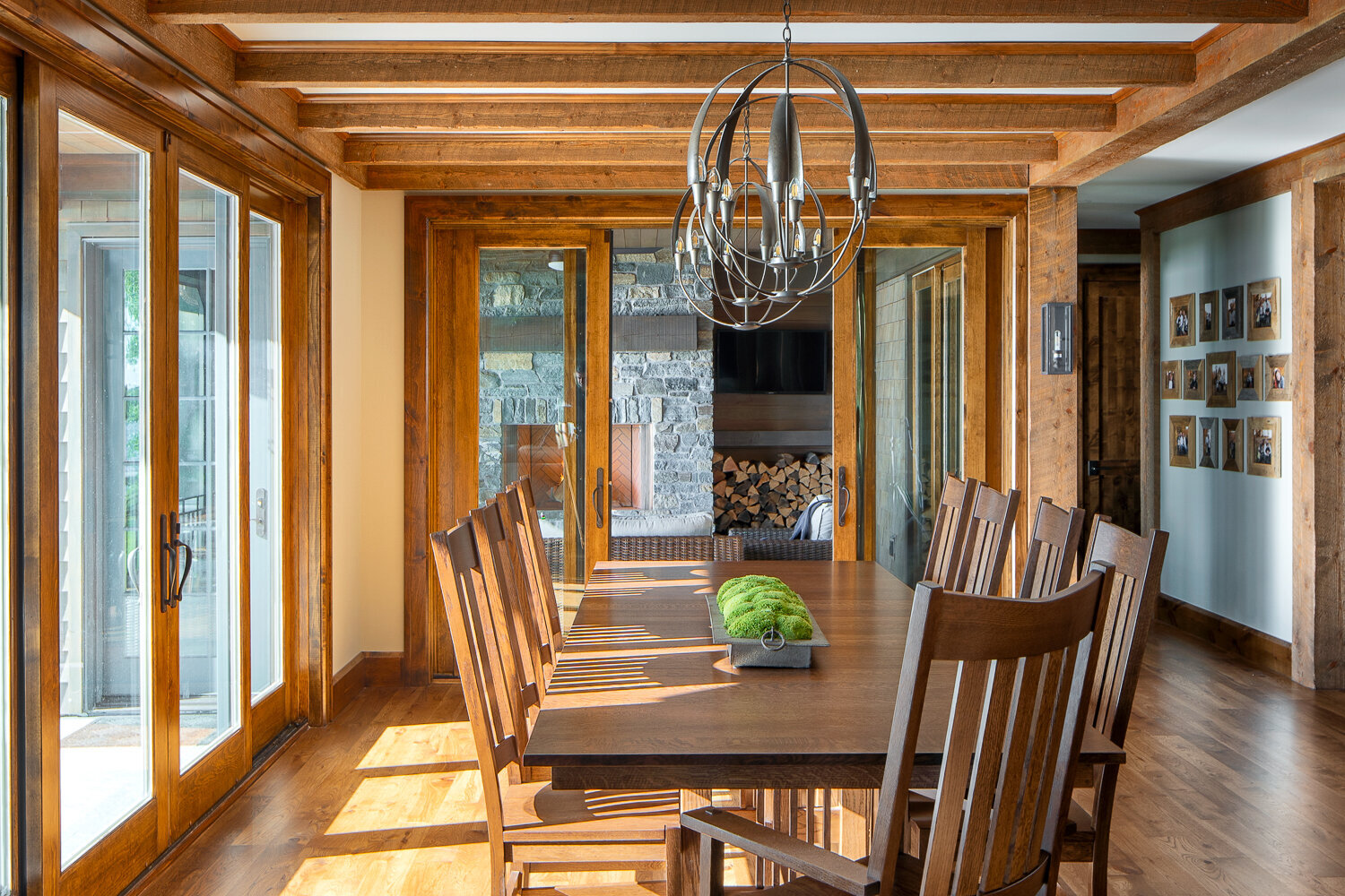 Beautiful rustic dining room with floor to ceiling windows