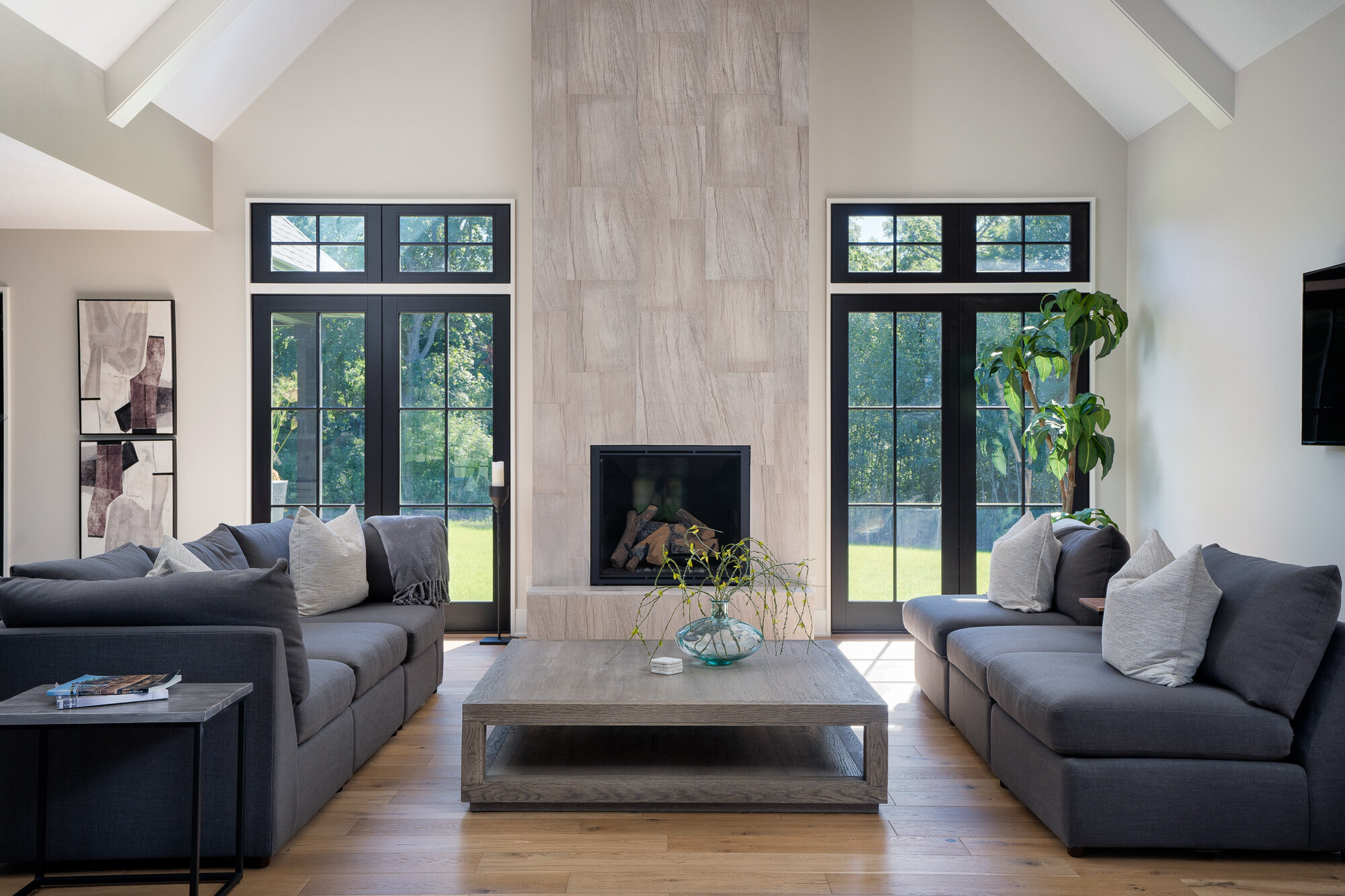Modern living room featuring a fireplace surround with Vetter Stone