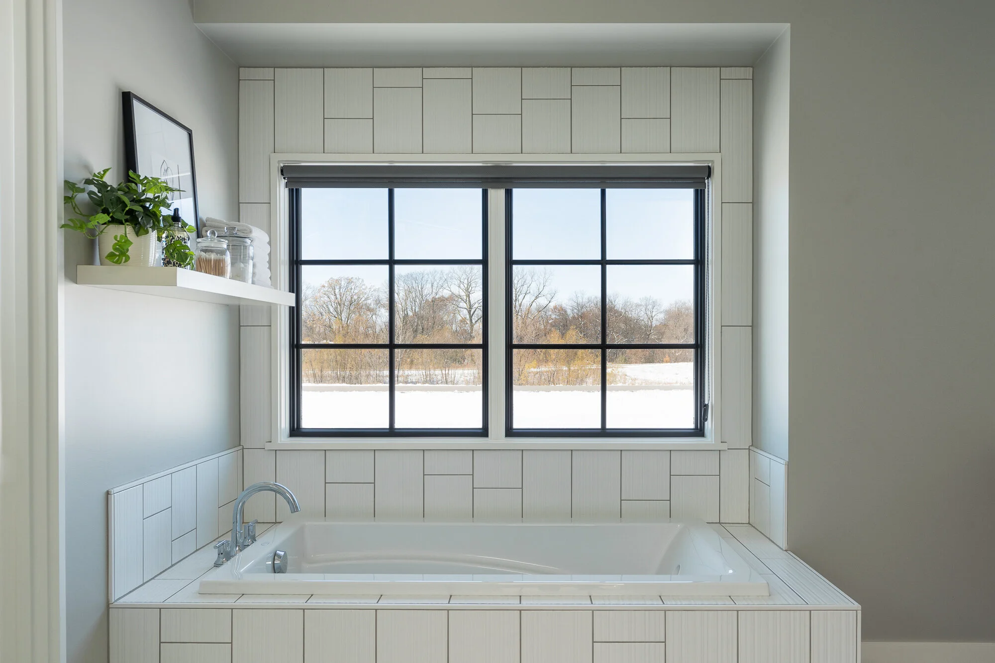 Modern bathtub featuring beautiful tile