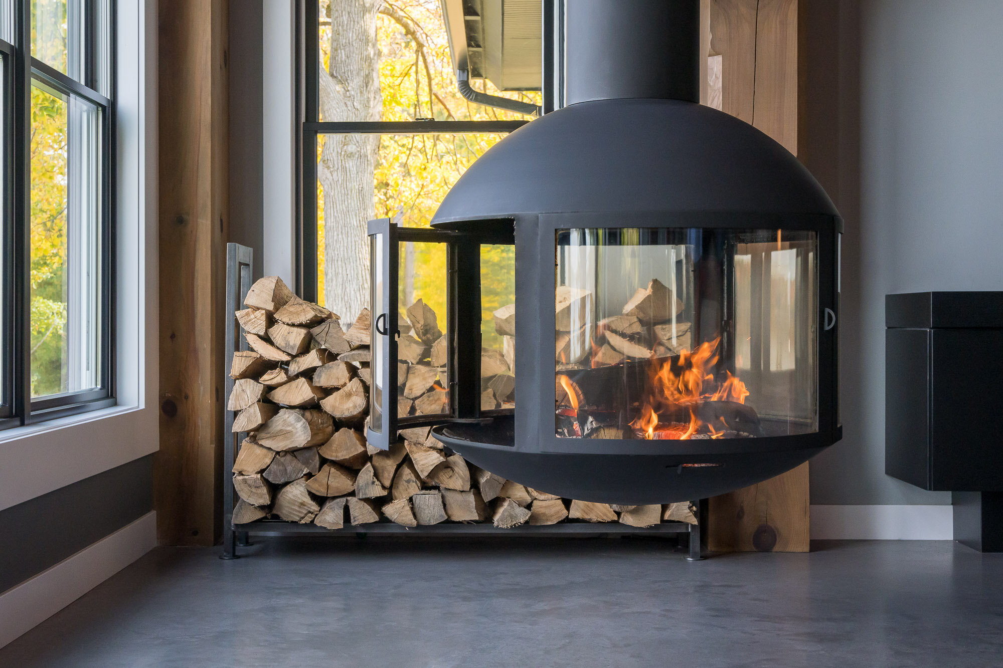 Fire burns in this European fireplace from focus.