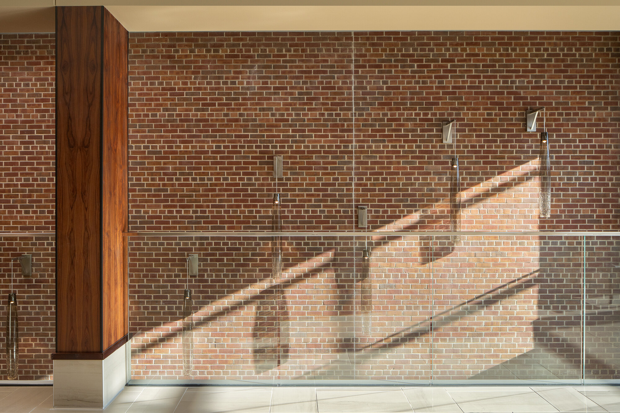 Commercial architectural photography featuring beautiful light casting across a brick wall