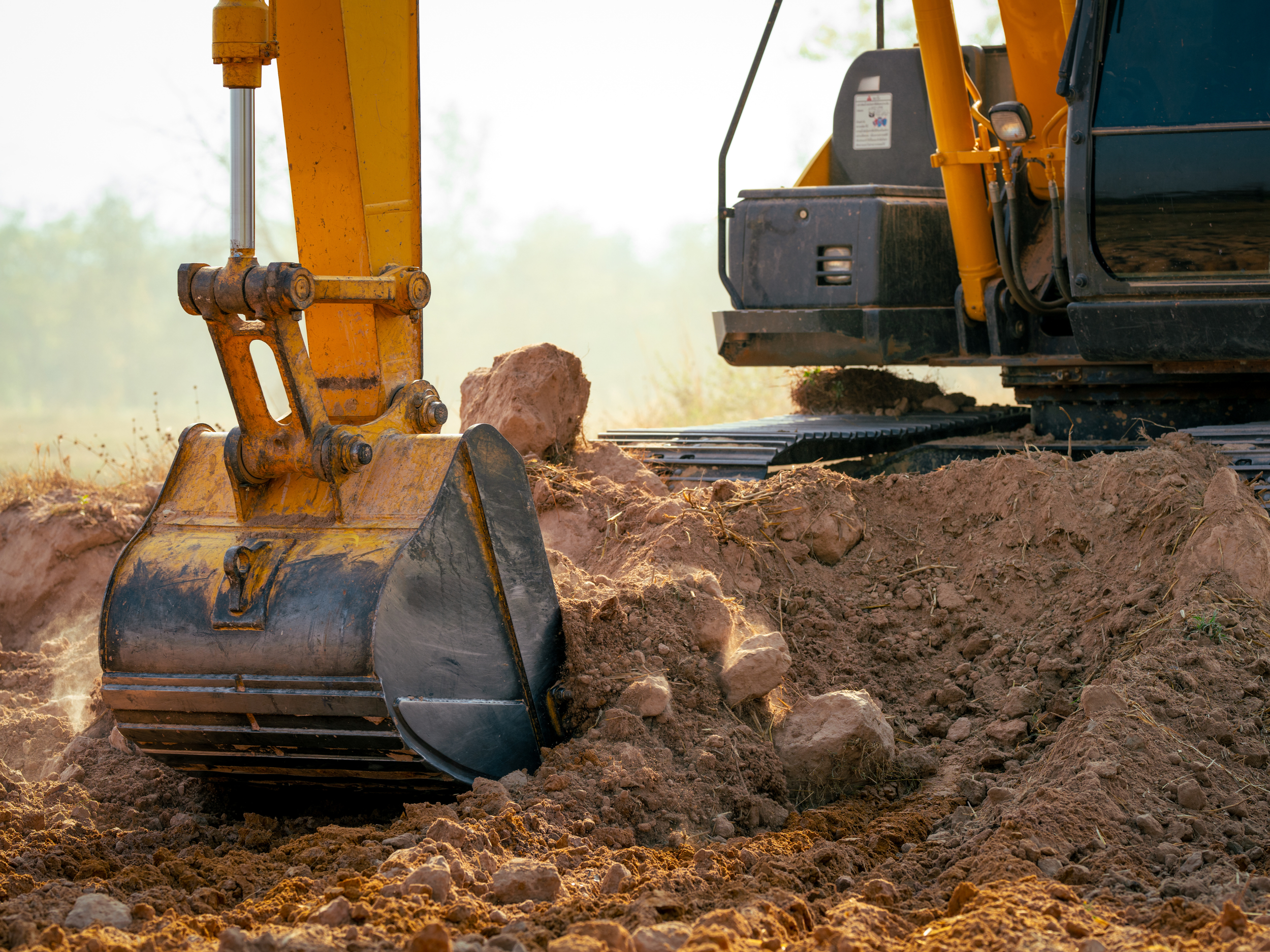 Excavator heavy equipment digging the dirt