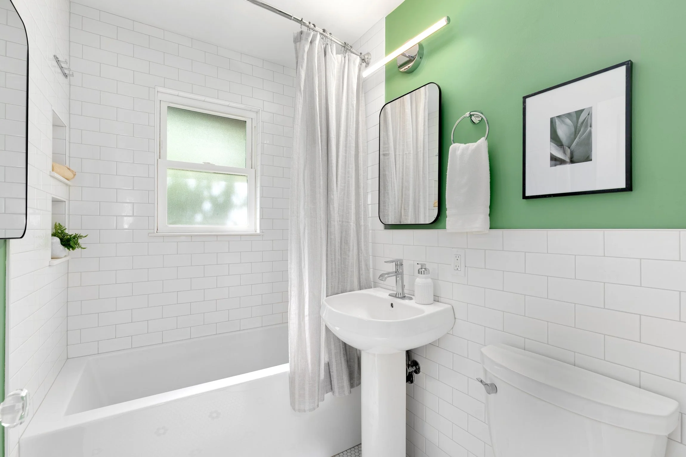 White subway tile and modern finishes with classy bathroom
