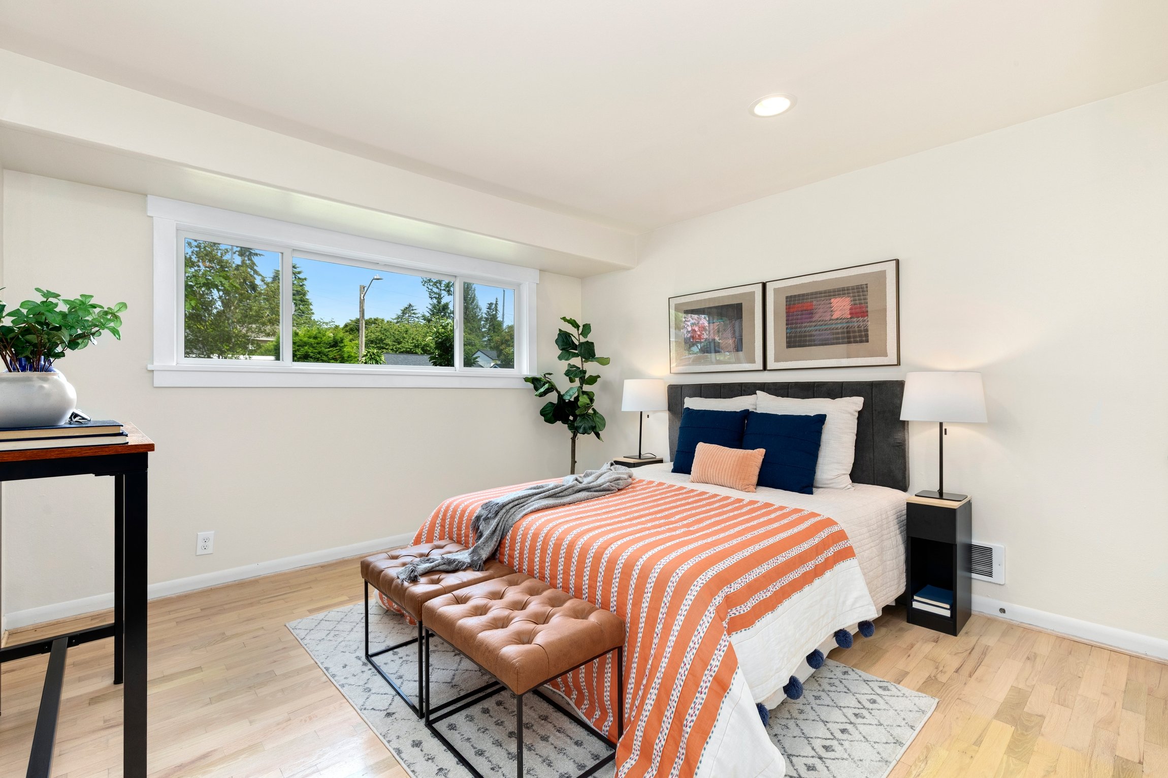 Modern bedroom with high ceilings and large windows