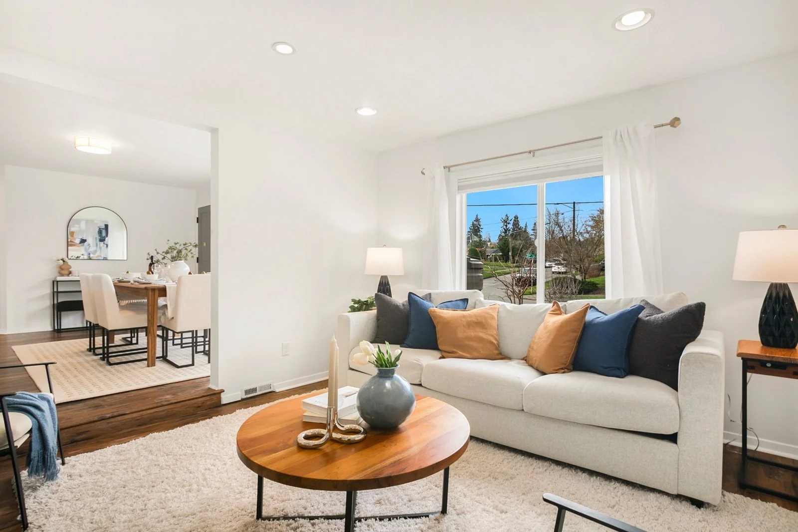 The large living area adds warmth and character, creating a cozy space to relax or entertain.