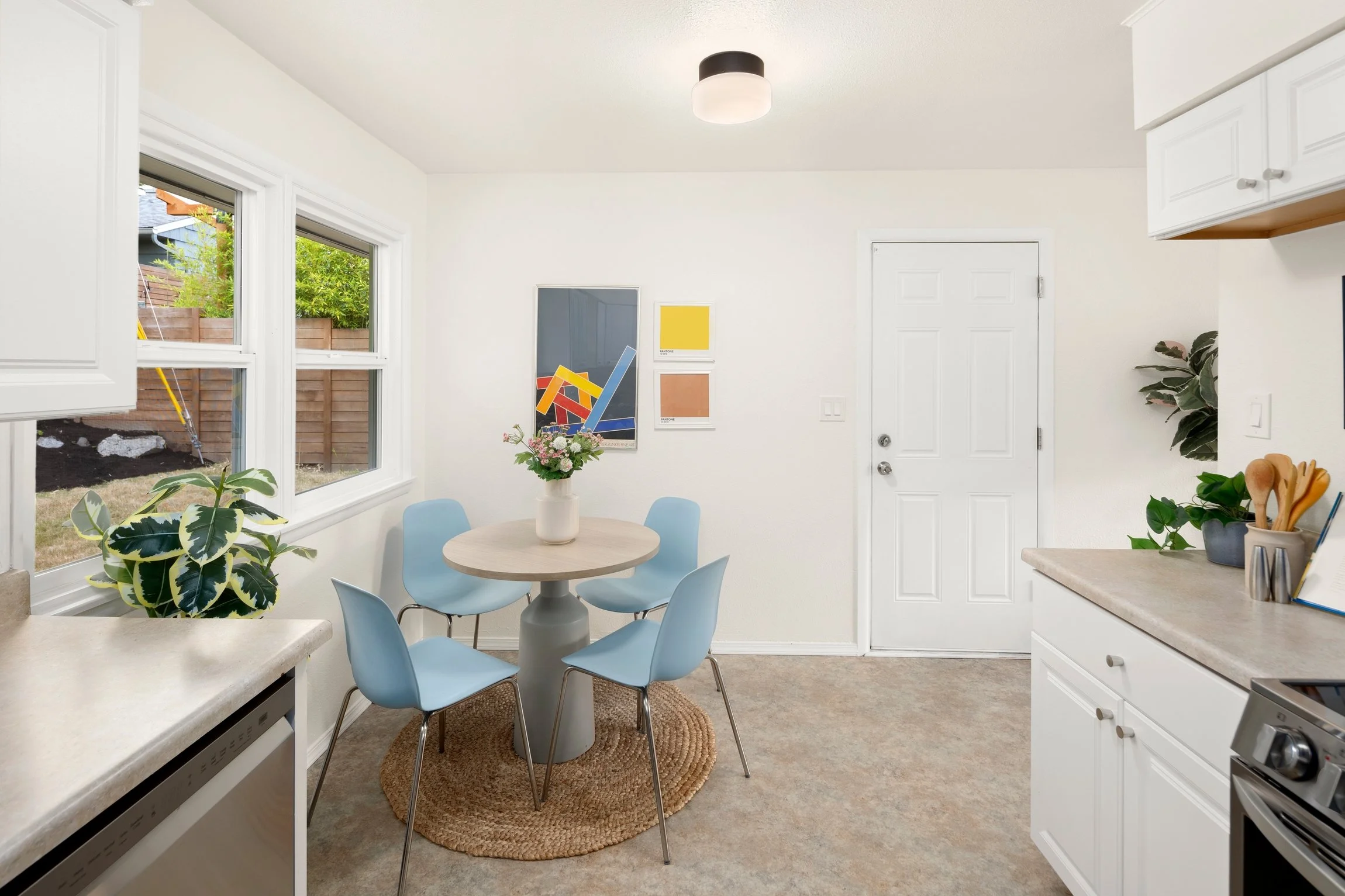 Plenty of space to host in this dining nook with large windows