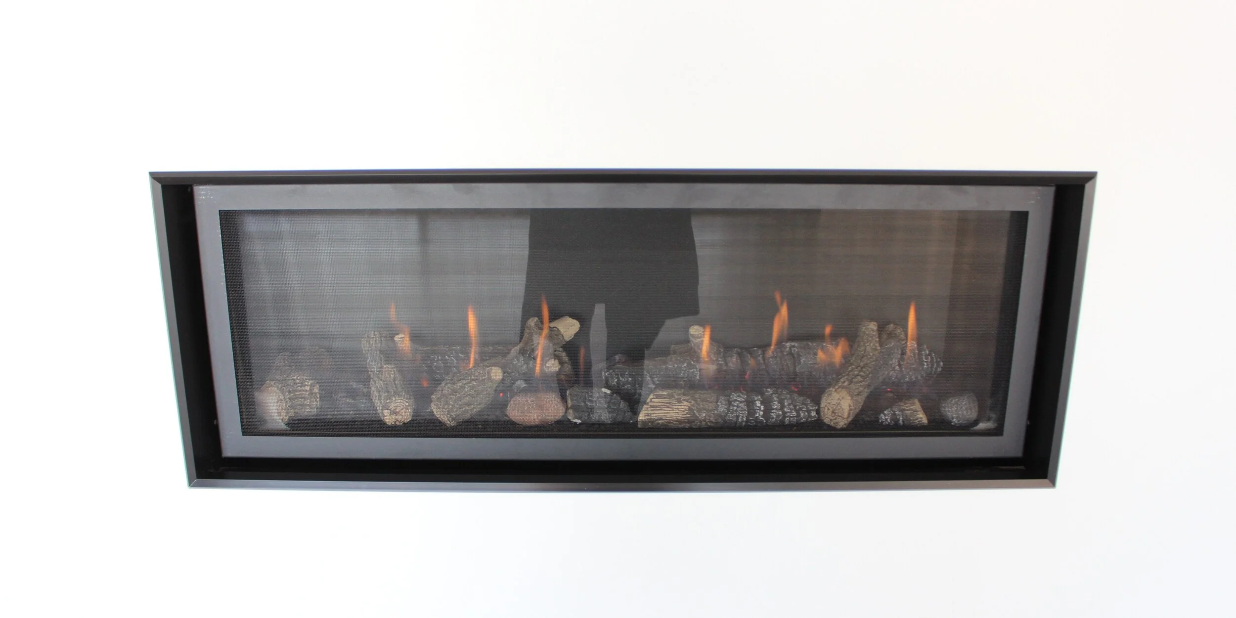 WOOD HEATERS VS GAS LOG FIRES