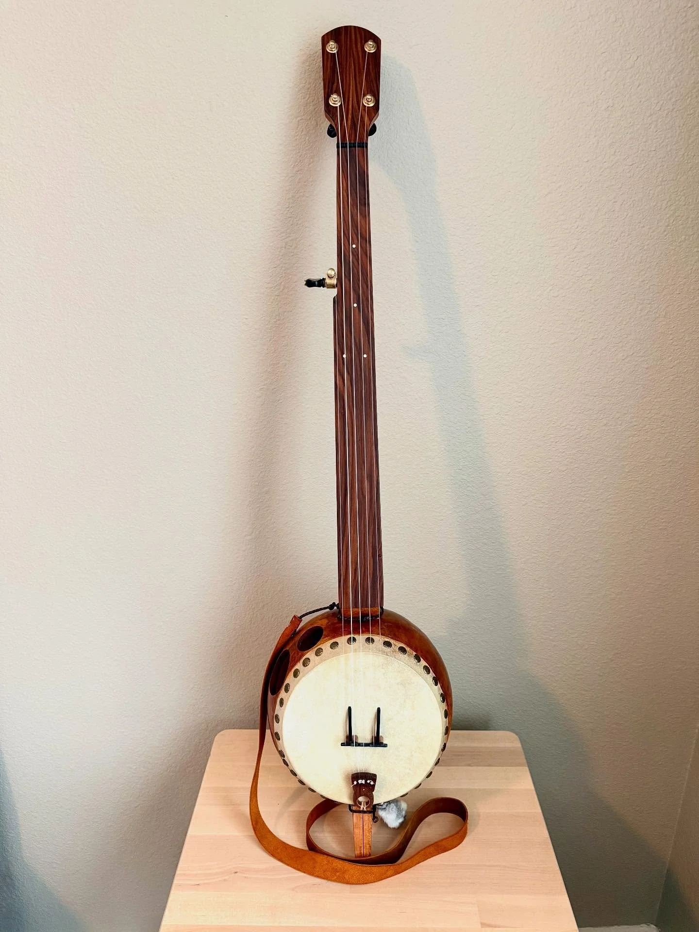 This is actually gourd banjo #8. Cherry, and morado with a maple Seeger inspired bridge and a stainless steel tone ring.