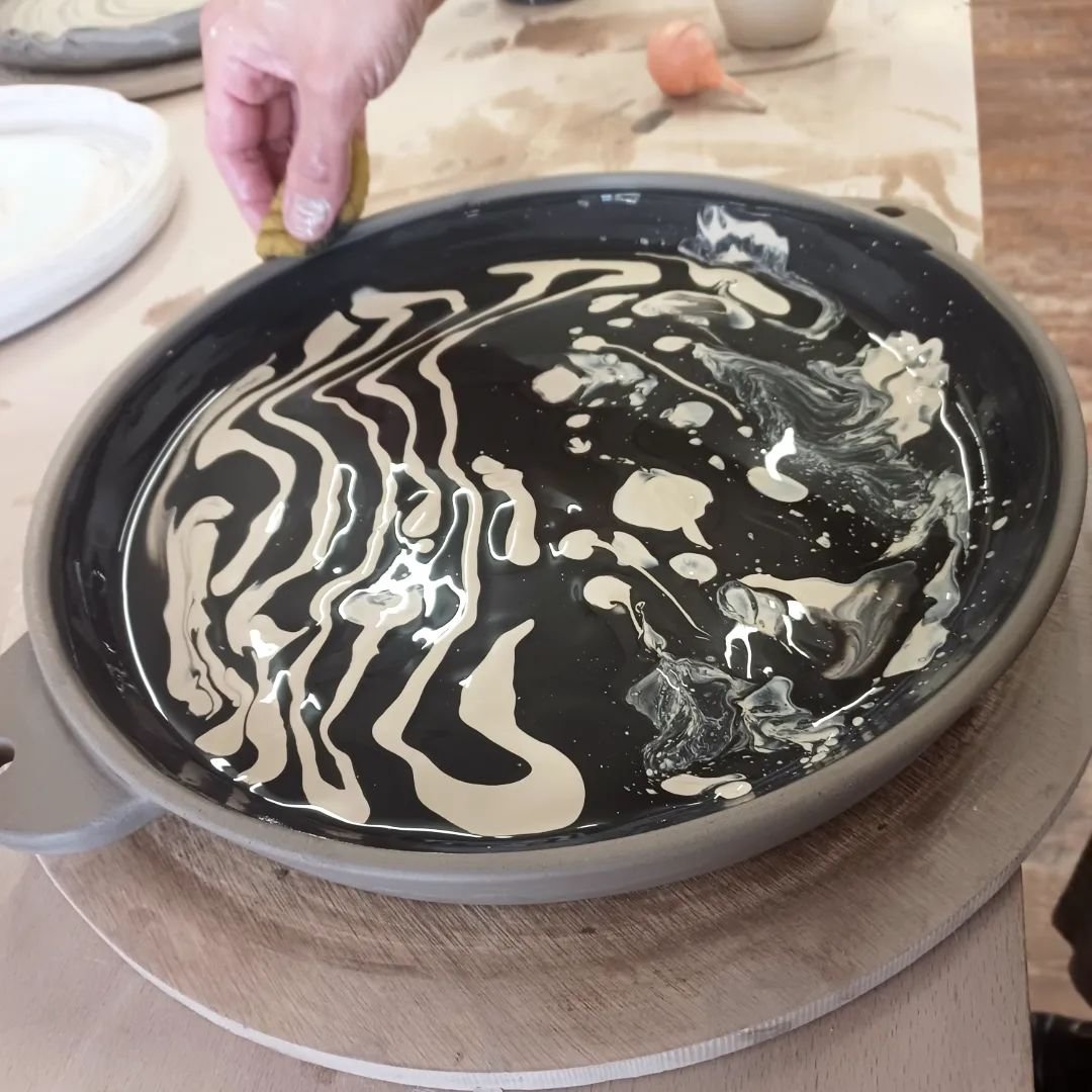 Slips are so versatile and can be fun and expressive, like this mixing of black and white swirled together. 
Our Friday intermediate class is for those with experience throwing and want to work towards set projects each term. Come join us on Fridays 