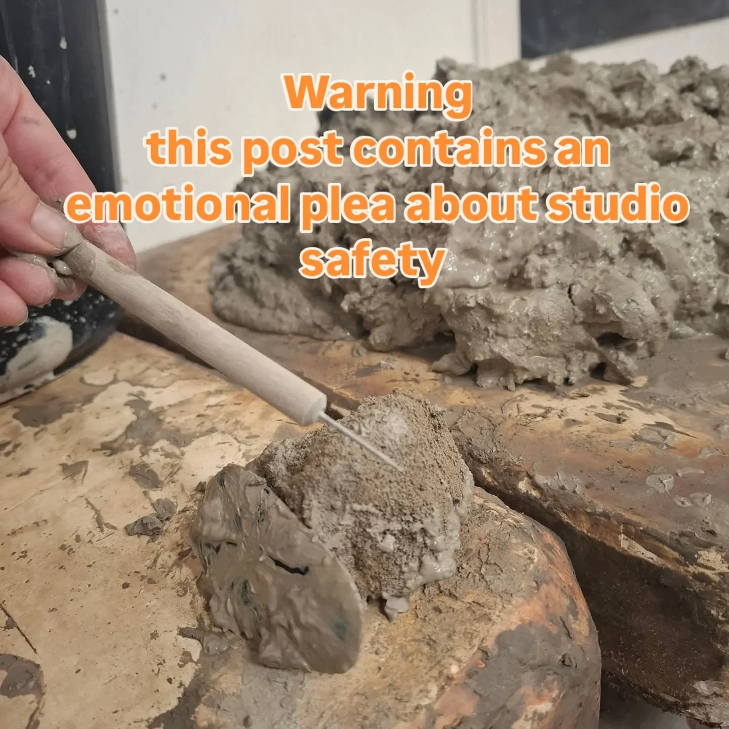 Our studio assistants use their hands to mix the clay reclaim slop buckets so it's prepared and ready to use again.
Having a needle tool stuck into the palm of your hand or finger is very dangerous and can cause serious injury. 
It's also deeply fru
