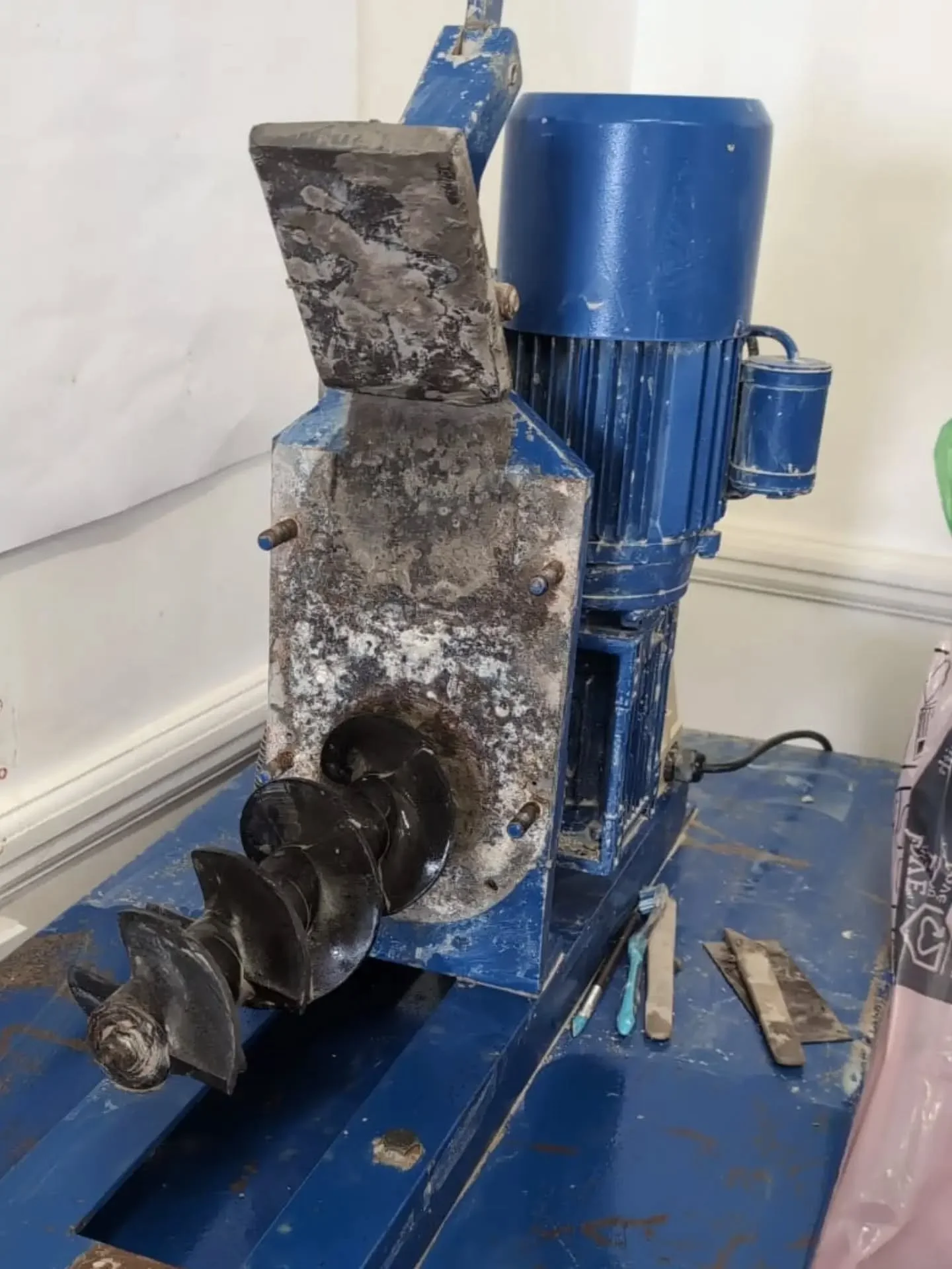 The inside of one of our most essential pieces of equipment- our pugmill. 
With 8 wheel throwing classes per week and members, we have a lot of clay to reclaim and the pugmill is our best friend.  We hope it's going to be okay after a deepclean and s