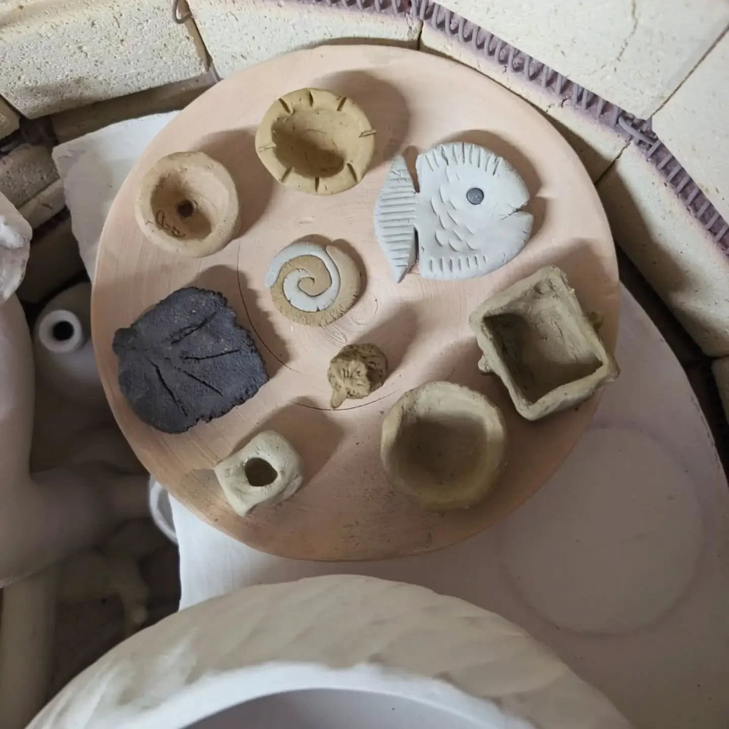 Introduction to Wild Clay Course. 
We fired the students work to earthenware temp- 1120 and also stoneware- 1250. 
Some clays still hold their form and the iron is a rich colour at 1250.  The light clay from Hastings beach stays very light and almost