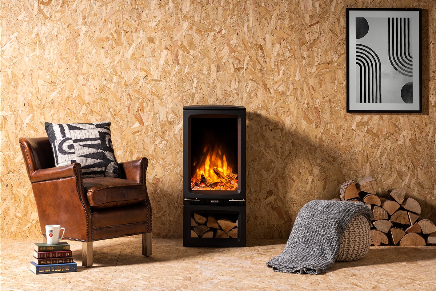 Front view of Vogue Midi T Stove with electric flames in chip board living room