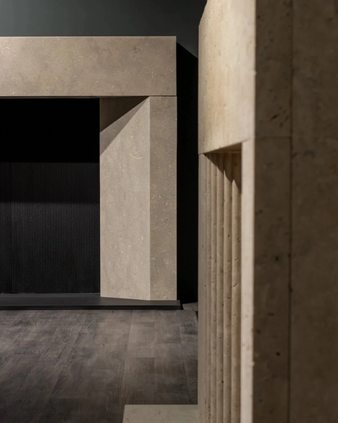 A photograph showing an two contemporary limestone fireplaces