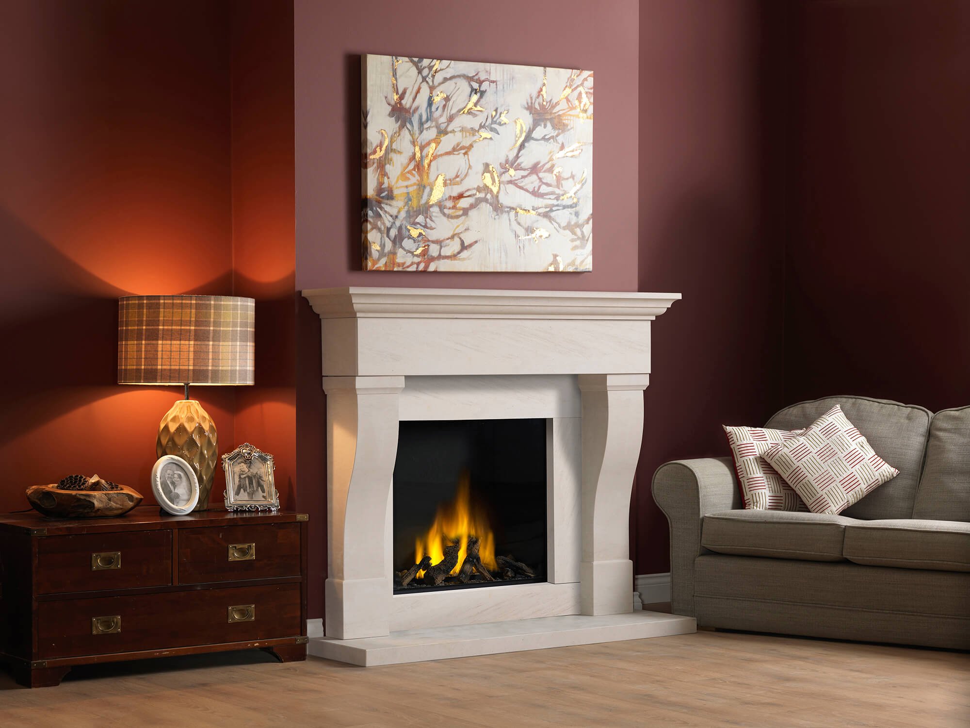 A limestone fireplace in a living room