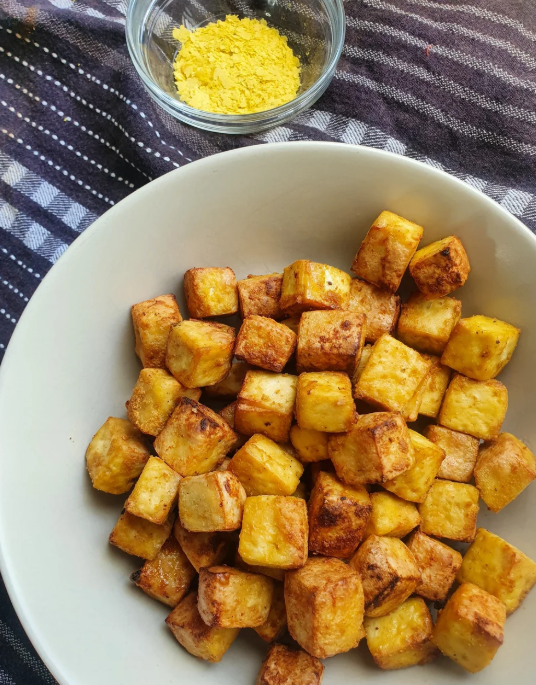 Cheesy air fryer tofu bites with nutritional yeast
