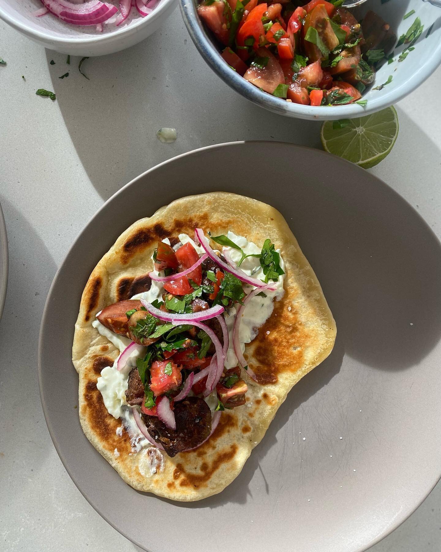 Not postpartum specific but delicious. On placement at the moment and my meal prep for shifts is not up to scratch, delighting in some time off on Sunday to make sourdough discard flatbreads, chermoula lamb, yoghurt + mint + zucchini, herby tomatoes,