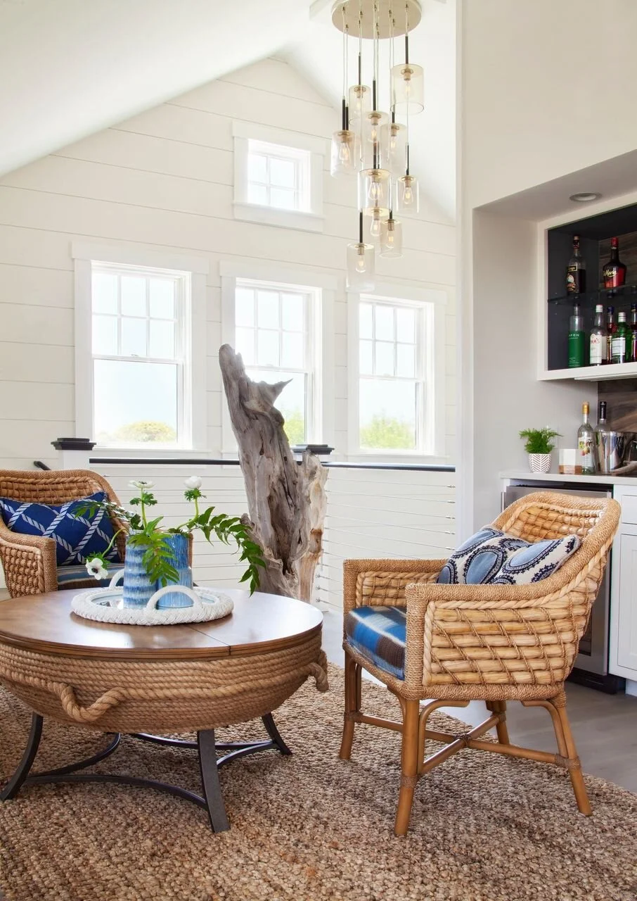 Seating Area with Wicker Furniture and Wood Sculpture in Nantucket Home