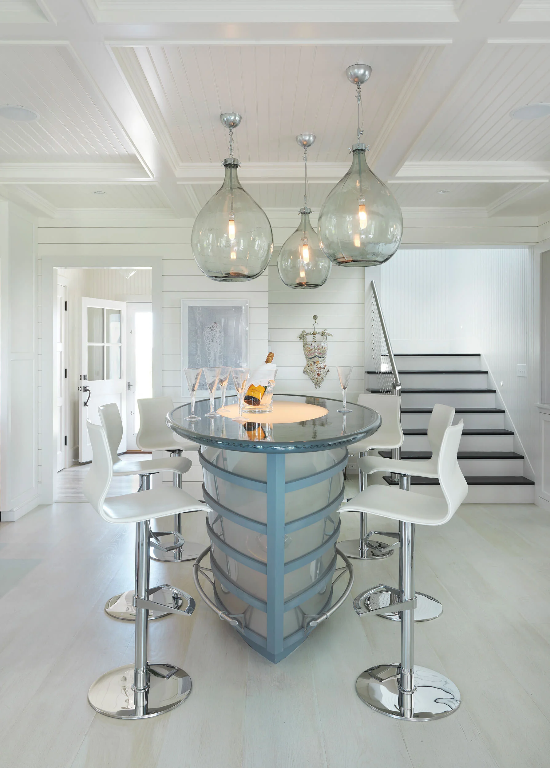 Ship Style Bar with Bottle of Champagne and Large Glass Light Fixtures in a Nantucket Home
