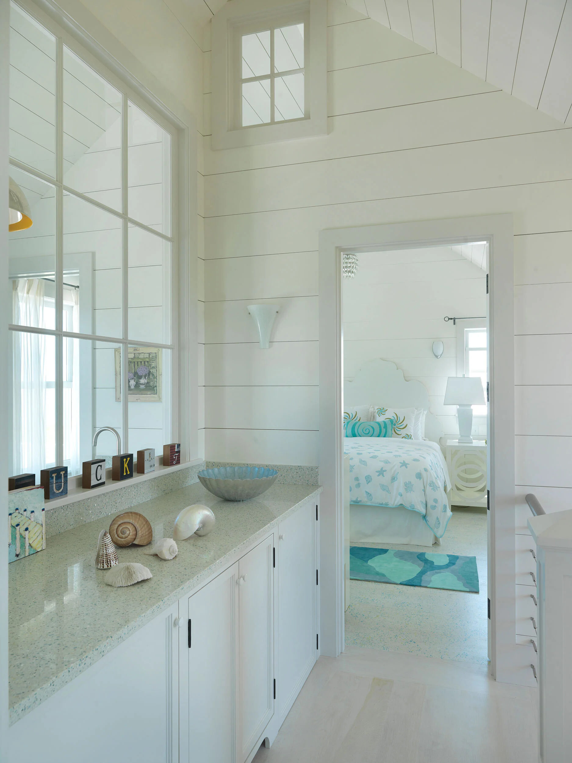 White Guest Bathroom with Shiplap and Small Window in Nantucket Home