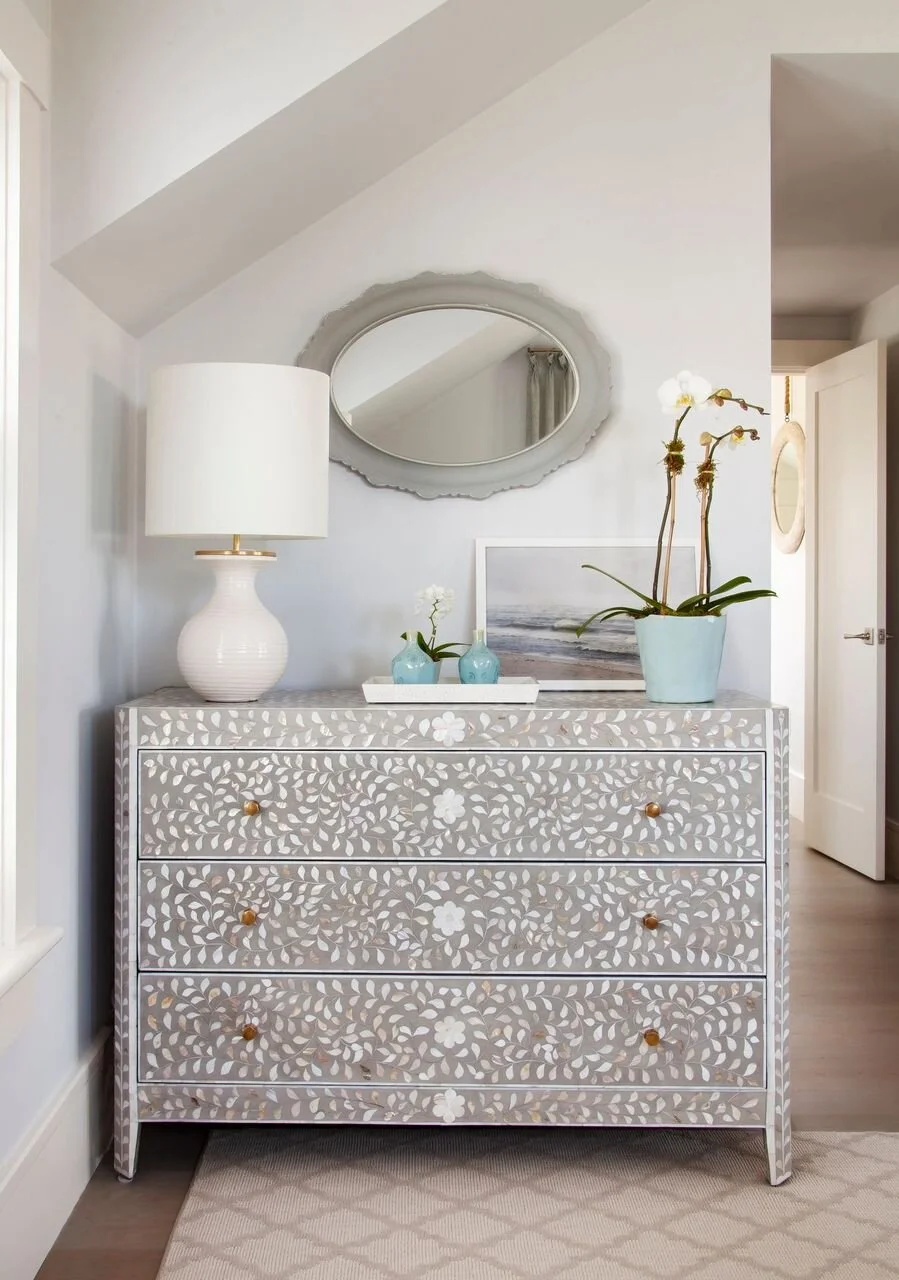 Wooden Dresser with an Intricately Carved Design in Nantucket Home