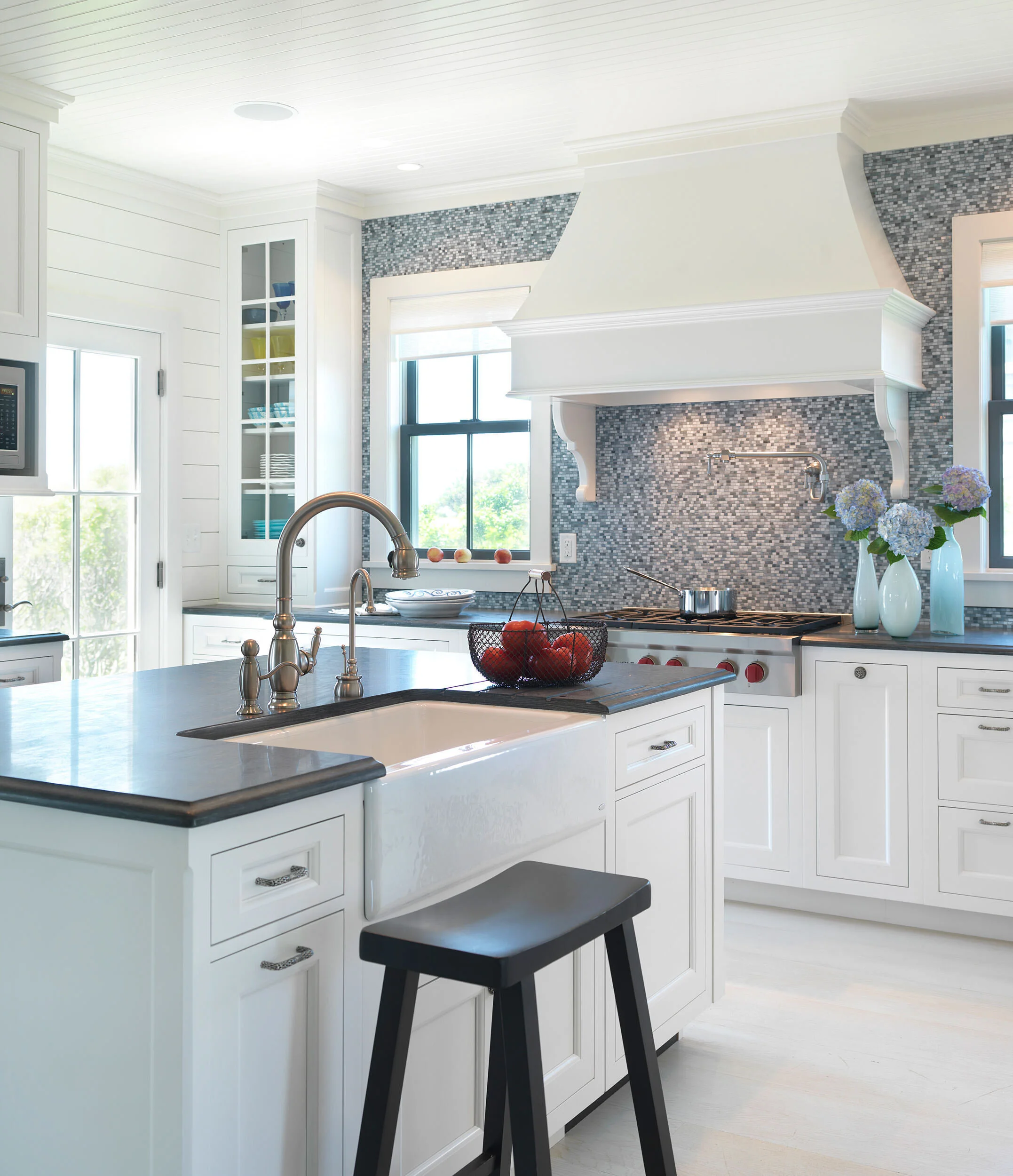 Large Kitchen with Blue Backsplash and White Cabinetry of Nantucket Home