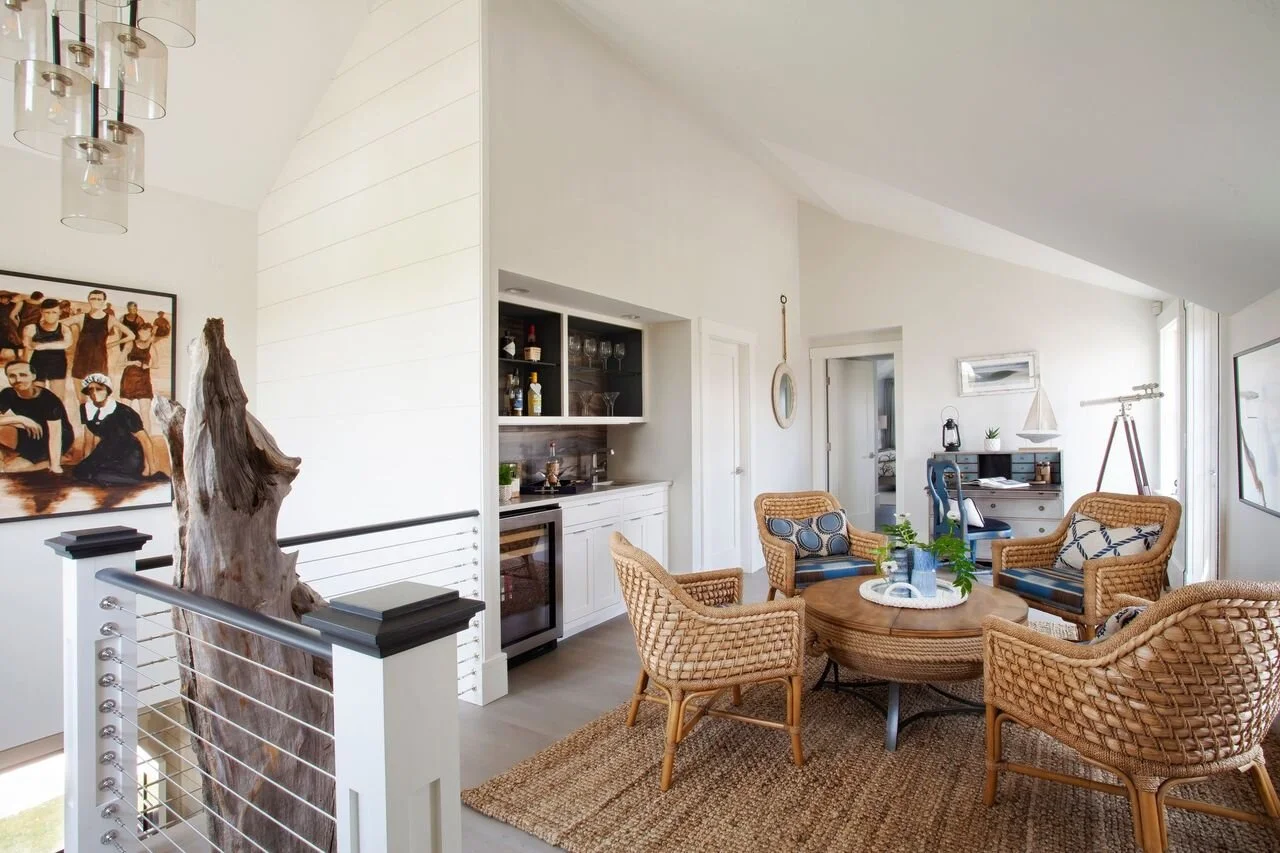 Seating Area with Wicker Furniture and Wood Sculpture in Nantucket Home