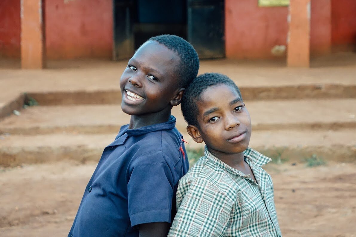 Two boys smiling in Tanzania