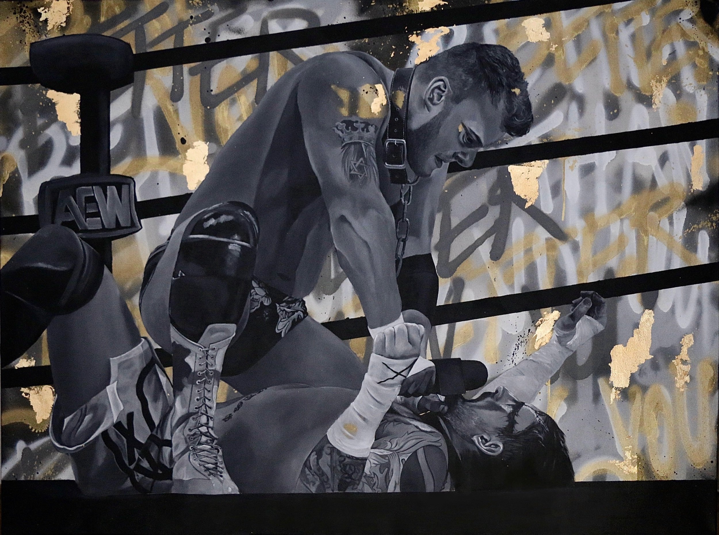 Street art mural depicting two male wrestlers in black and white with gold accents. One wrestler is on top, pinning the other in a wrestling match near a ring.
