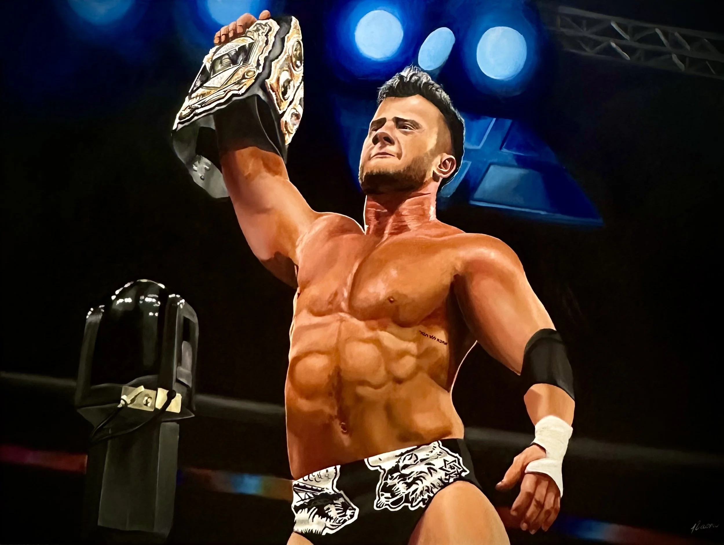 A male professional wrestler with a muscular build, holding a championship belt high above his head with one hand, wearing black and white wrestling trunks with a lion face design, and black armbands, standing in a wrestling ring with blue lights ove