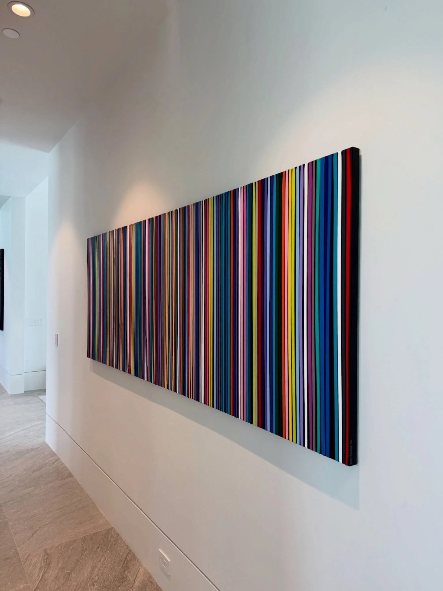 This is such a perfect example of why colorful original abstract art works so beautifully in a white space.

A long white wall like this wasn&rsquo;t meant to stay empty.

Against clean white walls and soaring ceilings, bold color has room to breathe