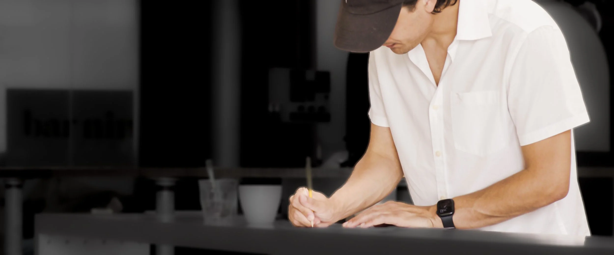 Zayde cupping coffee and taking notes
