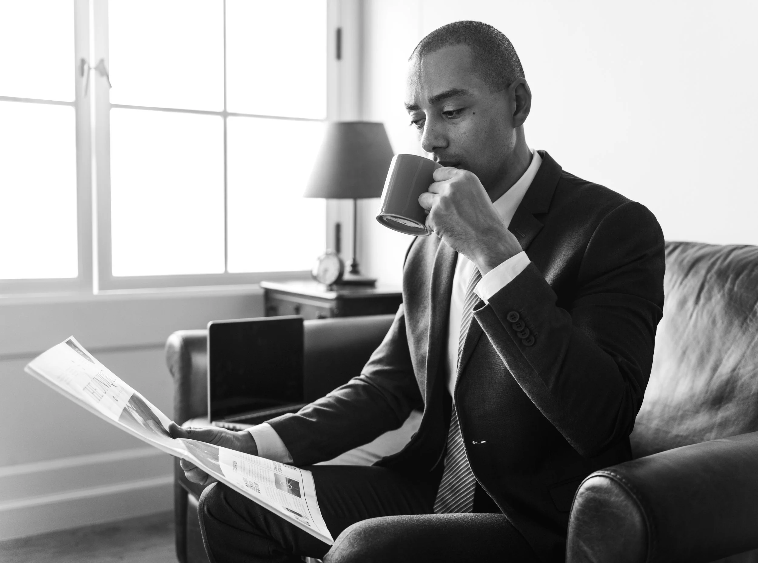 businessman-reading-newspaper-having-coffee.jpg