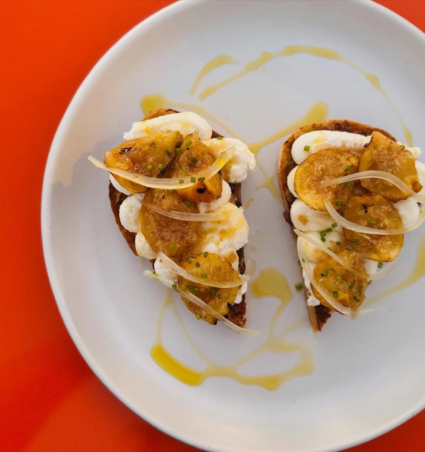 We have a new tartine on the menu! 
It’s a roasted fig with ricotta, stonefruit umeboshi honey, and date relish. The figs are roasted over charcoal and have a lovely burnt marshmallow flavor. Mixed into the relish are sunflower seeds, pepitas,