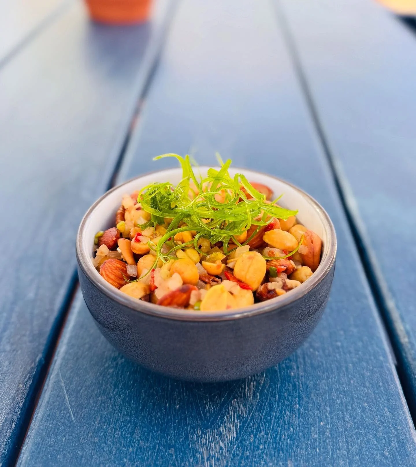 Have you tried our house smoked-mixed nuts yet? Finished with fish sauce, lime, chili, and onion, this savory snack is bold, balanced, and full of flavor. Available across all of our menus &mdash; snacks, Wine &amp; Dine, and our regular menu &mdash;