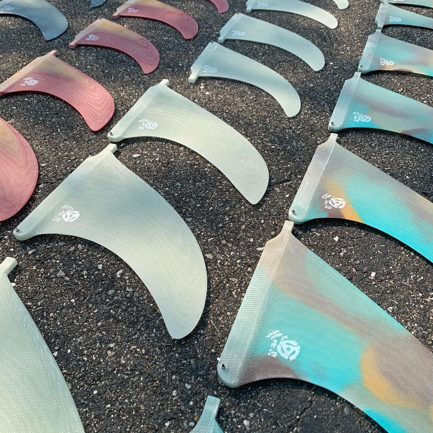 An absolute pile of fins are on their way to @adam.mar. Four different colorways and 5 different templates comprise this collection. Hand-dyed local indigo shibori inlays, clear volan, abstract and layered resin tint. Thank you, Adam, for your trust 