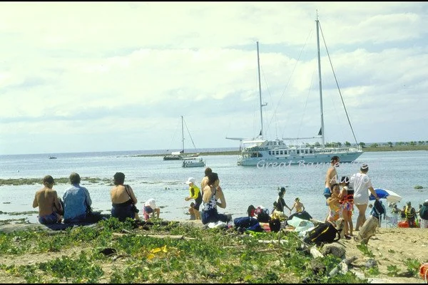 Tourists on beach; at Low Isles; with the Quicksilver pontoon and "Wavedancer" moored in the lagoon in background (1996)
Copyright J. Jones, Commonwealth of Australia (GBRMPA)