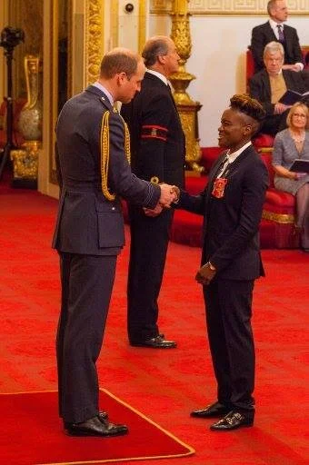 Olympic and Pro Boxer Nicola Adams receives her OBE from the Duke of Cambridge at Buckingham Palace, styled by Haili Pue