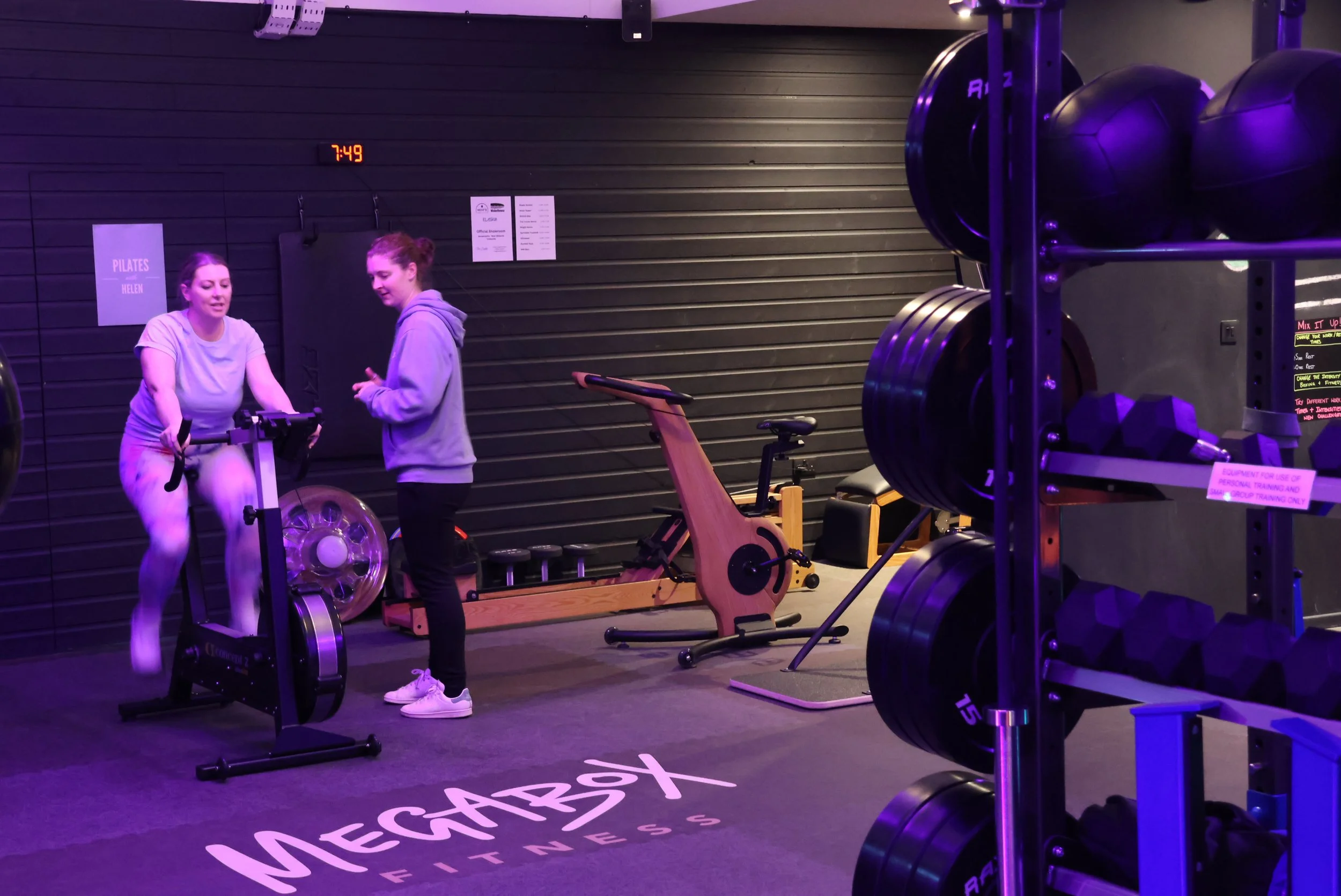 Personal trainer coaching a client at MegaBox