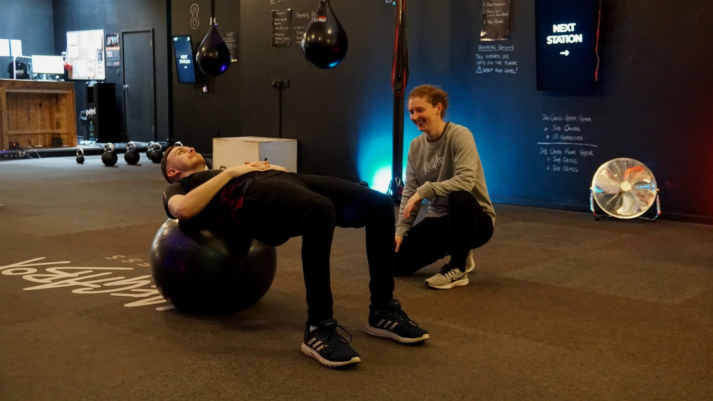 MegaBox Personal Trainer coaching a client