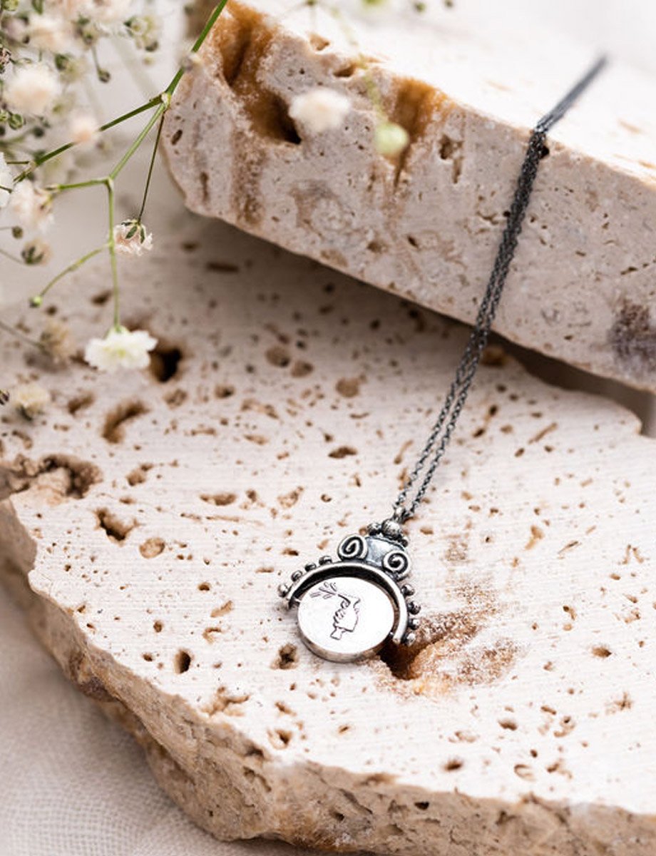 antiseptika-half-frame-spin-pendant-black-romy-mittelman-lifestyle-back.jpeg
