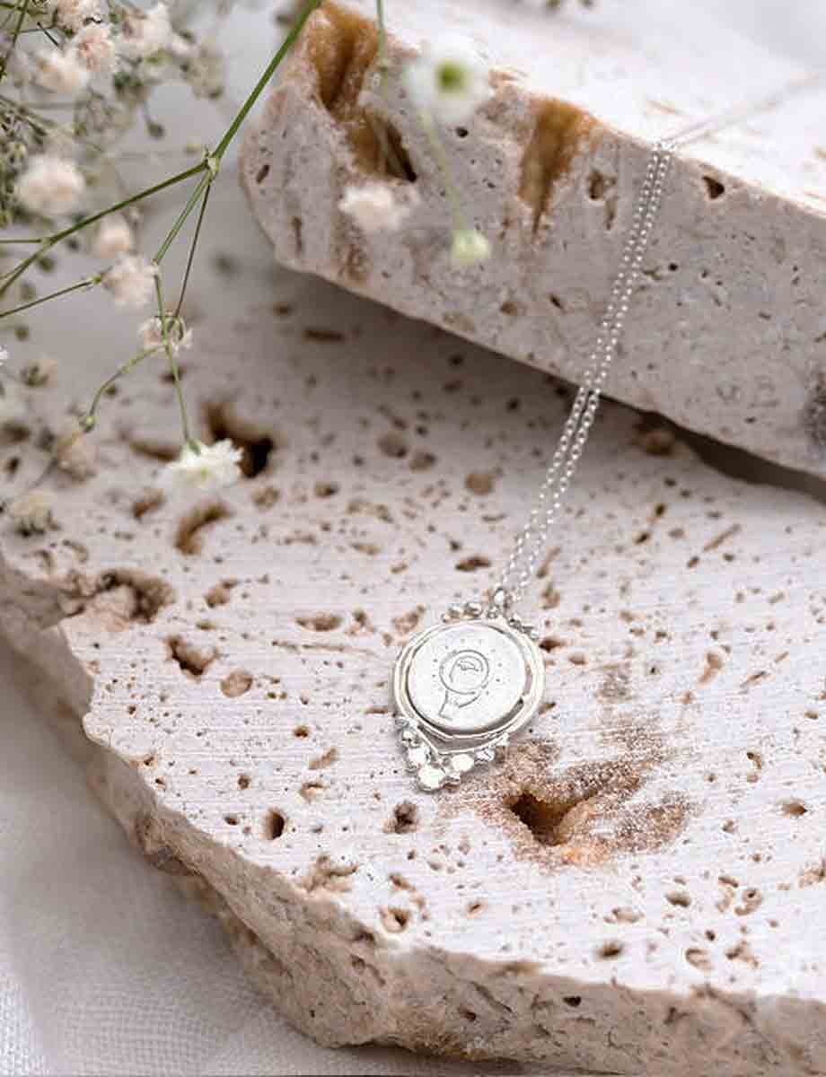veritas-full-spin-pendant-silver-romy-mittelman-back.jpeg