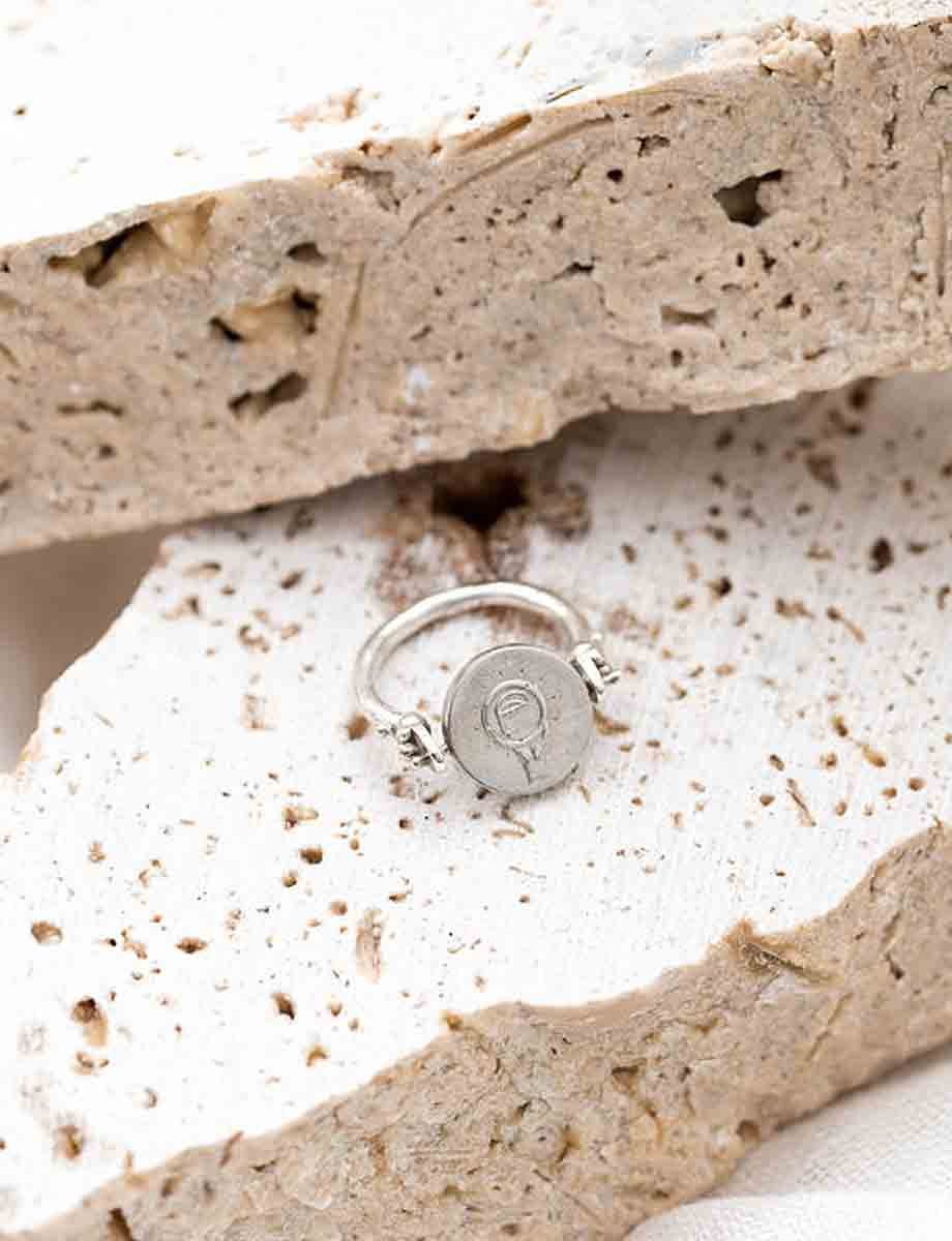veritas-spin-ring-silver-lifestyle-back.jpeg