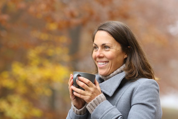 3 Reasons Joy Will Help You Achieve Your Best Self In 2022 3 Joyful+Woman+Drinking+Coffee+Outside+Copy