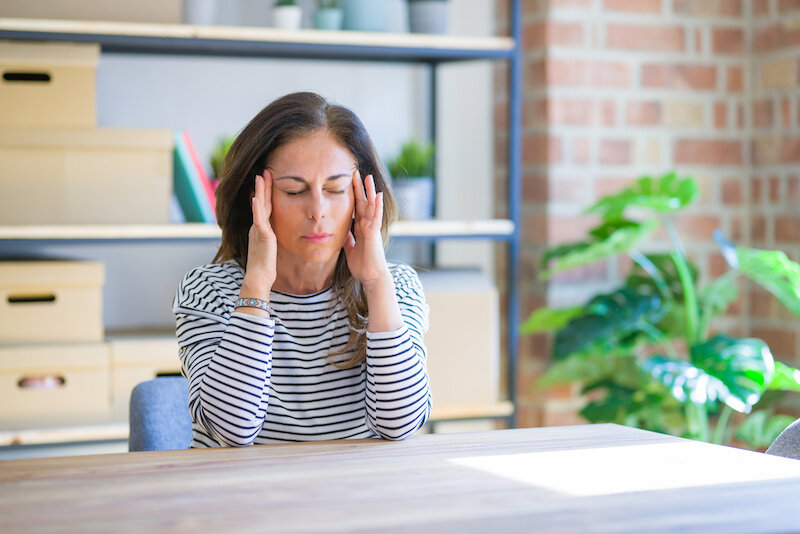 4 Ground-Breaking Questions To Ask About Your Wellness And Fitness 1 Woman Stressed Pausing.jpeg