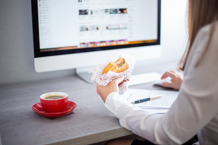 Woman+Eating+While+Working+Copy