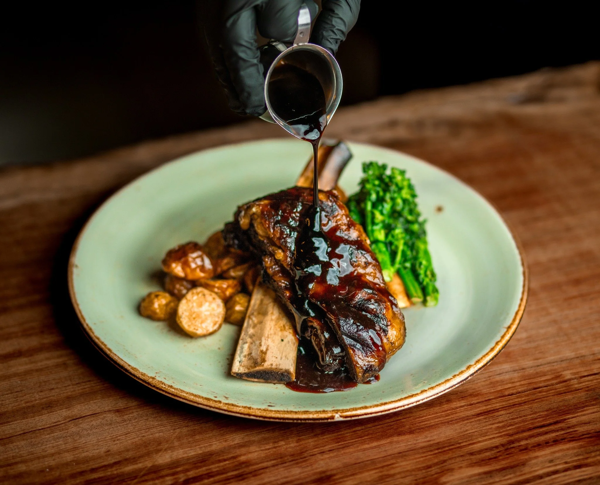 🍷 Savor the Elegance: Braised Beef Short Rib (GF) 🍴

Indulge in the rich, tender flavors of our Braised Beef Short Rib, slow-cooked in a rosemary red wine demi-glaze and served with roasted baby potatoes, seasonal vegetables, and a touch of parsley