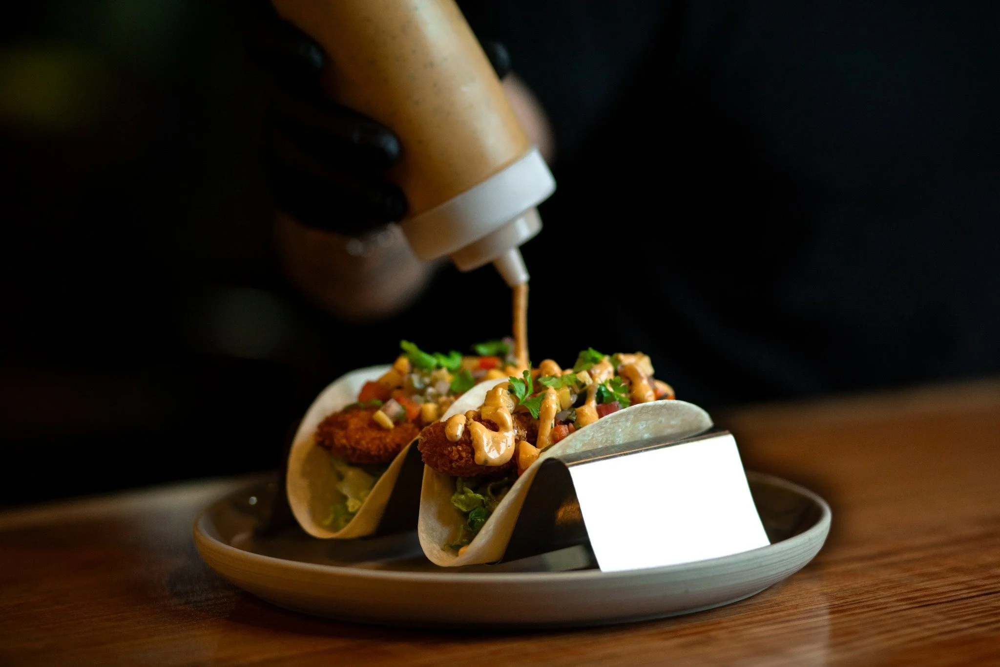 🌮 Fresh &amp; Flavorful: Fish Tacos Done Right 🐟

Dive into the perfect bite with our panko-crusted haddock, served on two warm, grilled flour tortillas. Topped with vibrant corn, pico de gallo, arugula, and a creamy guacamole drizzle, these tacos 