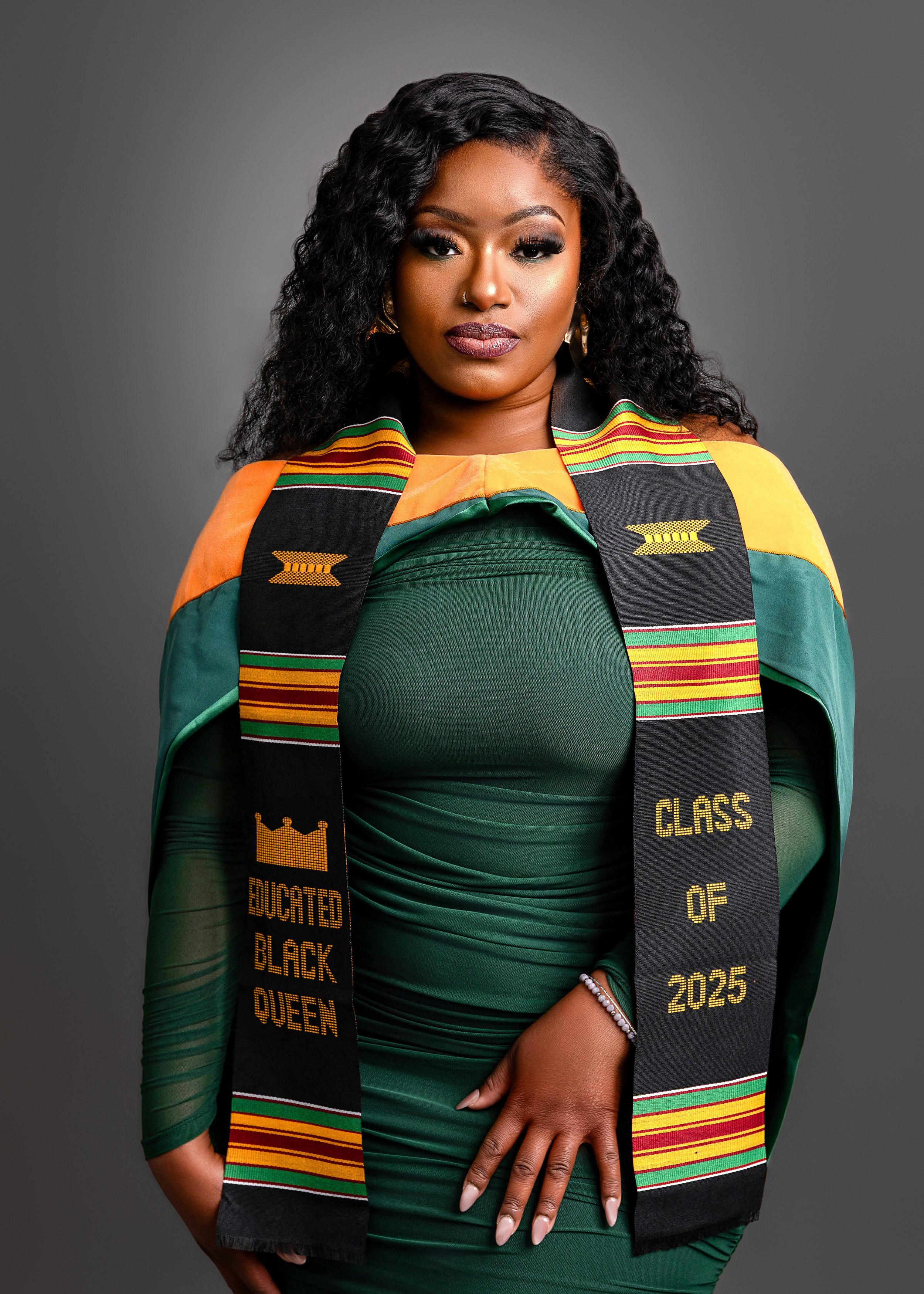 Graduation photo of a woman with her stole in Royal T Visuals Photography Dallas Studio
